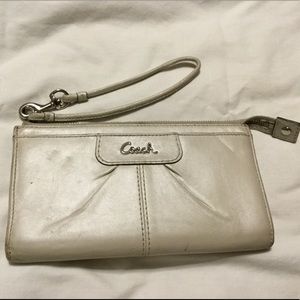 Cream Coach wallet with strap